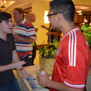 Zach Gospe talking with a fan at the New Horizons EP release party.